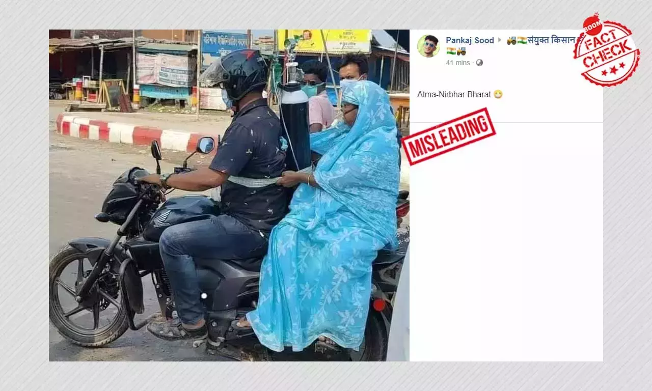 বাইকে অক্সিজেন সিলিন্ডার সমেত কোভিড রোগী নিয়ে যাওয়ার ছবিটি বাংলাদেশের বাইকে অক্সিজেন সিলিন্ডার সমেত কোভিড রোগী নিয়ে যাওয়ার ছবিটি বাংলাদেশের